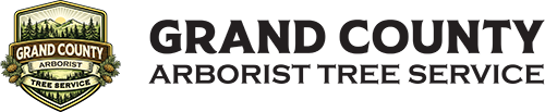 Grand County Arborist Tree Service logo: shield with trees, mountains, and a banner